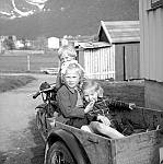 CW0489.jpg   Neverdal.       Ut på  &quotkjøretur" med Chr. Waatviks trehjuling?  ca. 1953.